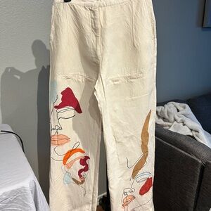 Artistic Cream Pants with Abstract Faces